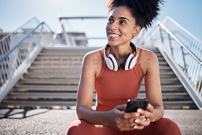 Buy stock photo Fitness, headphones and smartphone with woman on stairs thinking of workout, exercise or training website, blog or social media. Mental health technology, sports music and happy black woman in city