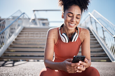 Buy stock photo Fitness, phone and black woman in city on break on social media, texting or web browsing after exercise. Sports, cellphone and happy female athlete by stairs with 5g mobile smartphone for networking.