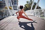 Sports, stretching legs and woman on ground or city bridge exercise, running and training in sports shoes fashion. Warm up, focus and athlete or black woman workout for body, muscle and health goals