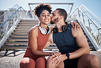 Sports, love and man kissing woman on stairs in city on break from exercise workout. Motivation, health and fitness goals, couple rest and kiss with smile on morning training run together in New York