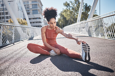 Buy stock photo Stretching legs, fitness and black woman on city bridge for exercise, running or training in sports shoes fashion. Warm up, focus and urban athlete on ground workout for body, muscle and health goals