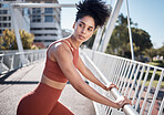 Black woman, fitness and stretching, running in city and exercise outdoor, focus and strong with muscle training. Runner, athlete and sport motivation, person on bridge for run and health wellness