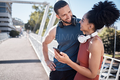 Buy stock photo Fitness, exercise and black couple with phone in city for running, marathon training and workout on bridge. Love, sports and man and woman on smartphone for social media, music and health mobile app