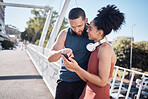 Exercise, fitness and black couple with phone in city for running, marathon training and workout on bridge. Love, sports and man and woman on smartphone for social media, music and health mobile app