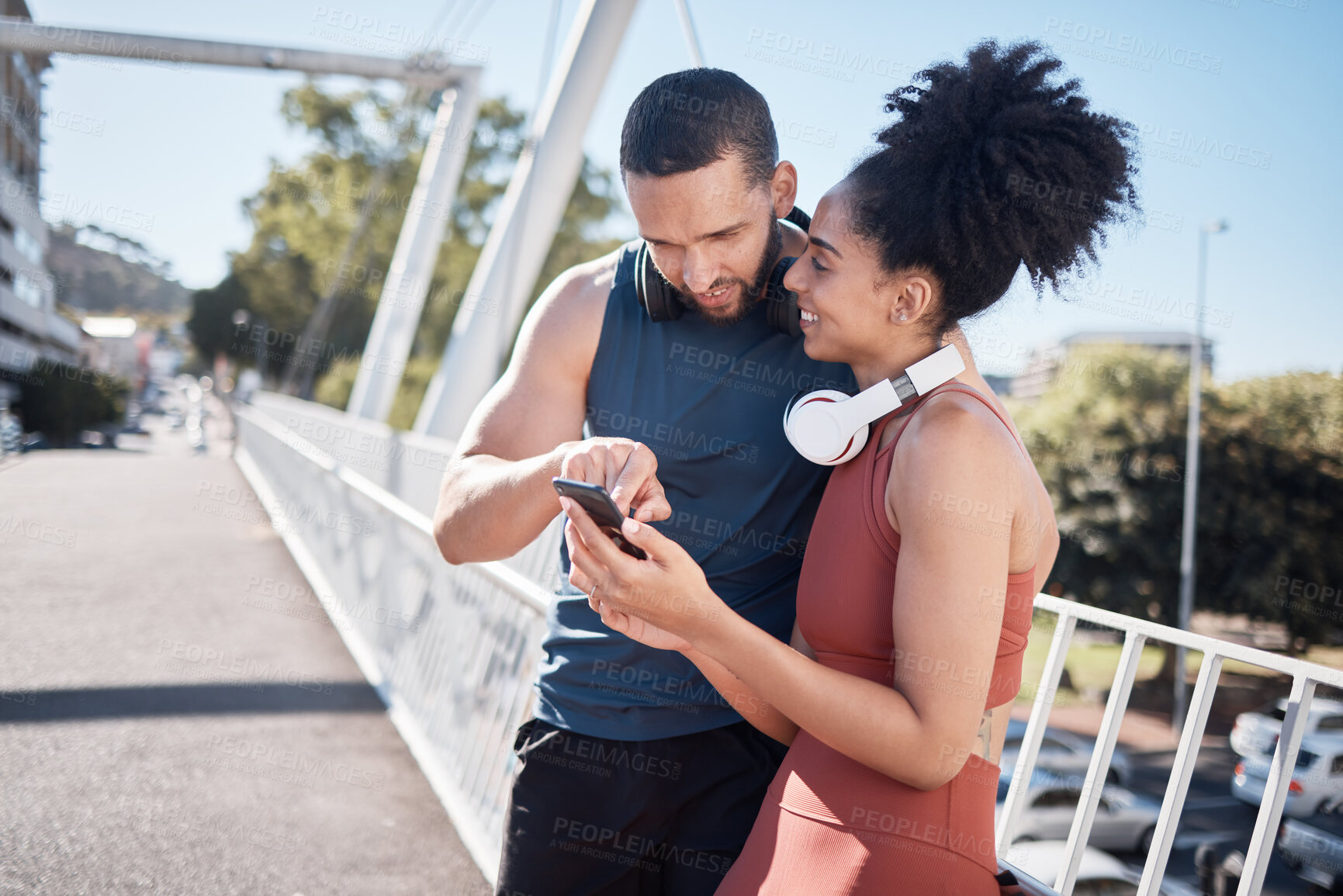 Buy stock photo Exercise, fitness and black couple with phone in city for running, marathon training and workout on bridge. Love, sports and man and woman on smartphone for social media, music and health mobile app