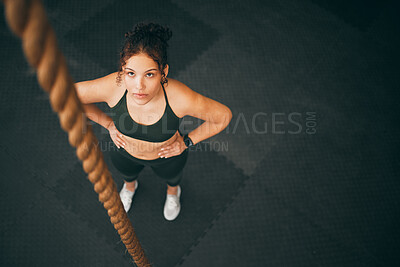Buy stock photo Rope climbing, gym and fitness woman with focus for sports challenge, full body workout and healthy training. Female athlete, climb exercise and top view with power, strong mindset and motivation 
