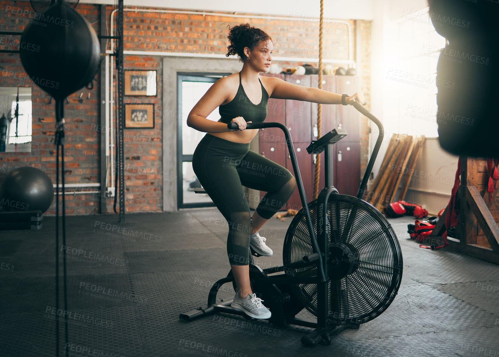 Buy stock photo Fitness, exercise bike and woman at gym for workout, cardio training and cycling for energy, balance and lose weight. Sports female or athlete with spinning machine for health, wellness and self care