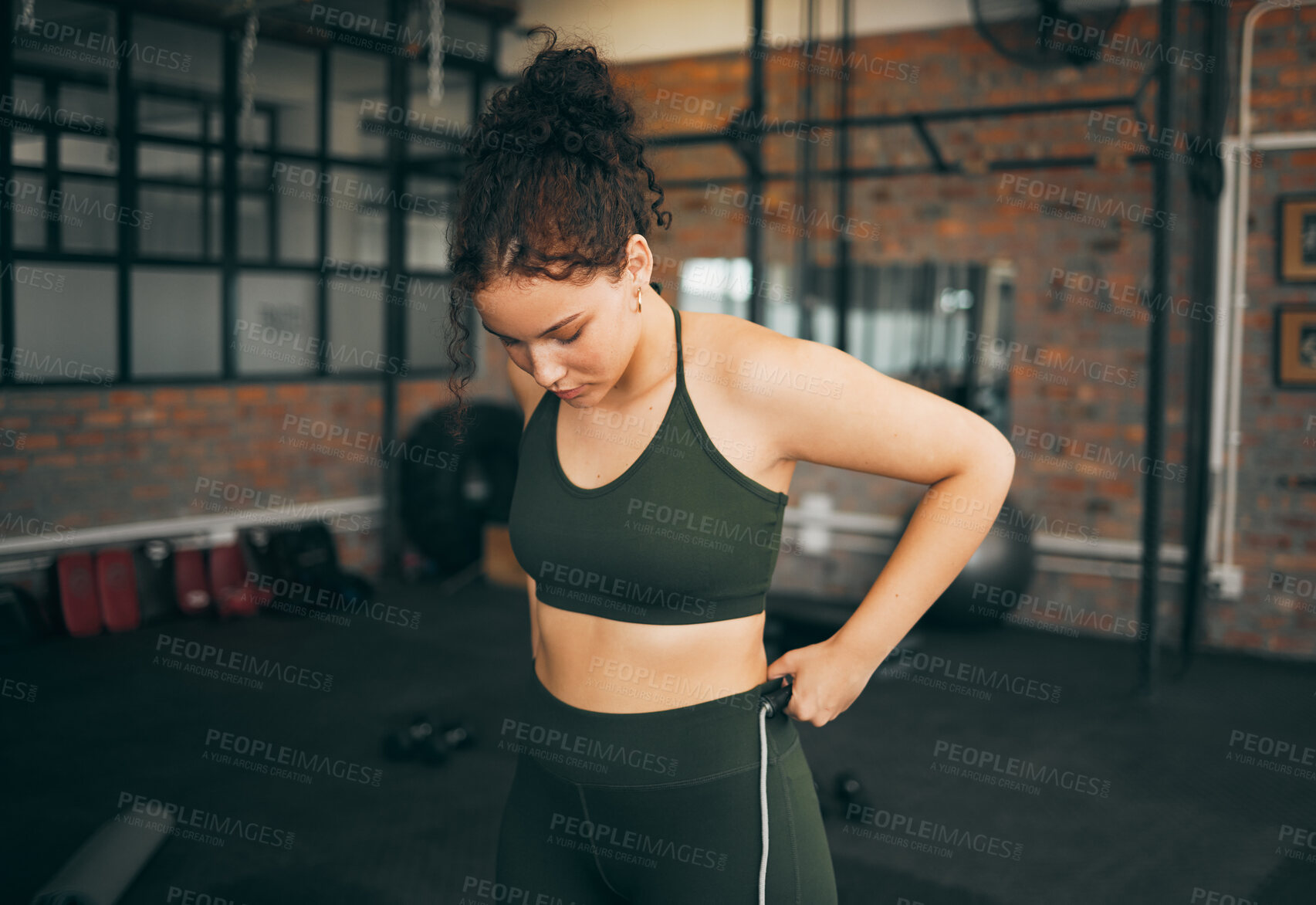 Buy stock photo Fitness, exercise and woman at gym to check body progess after training for health, balance and wellness. A young sports female or athlete strong and healthy while on diet and active to lose weight