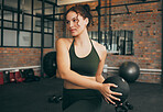 Fitness, medicine ball and exercise of a woman at gym doing weight training for body wellness, health and energy. Sports female with equipment for strong muscle power, balance and healthy lifestyle