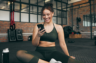 Buy stock photo Happy woman, fitness and phone at gym for a workout, training and body wellness with a mobile app. Sports female with smartphone for progress, performance and communication for a healthy lifestyle