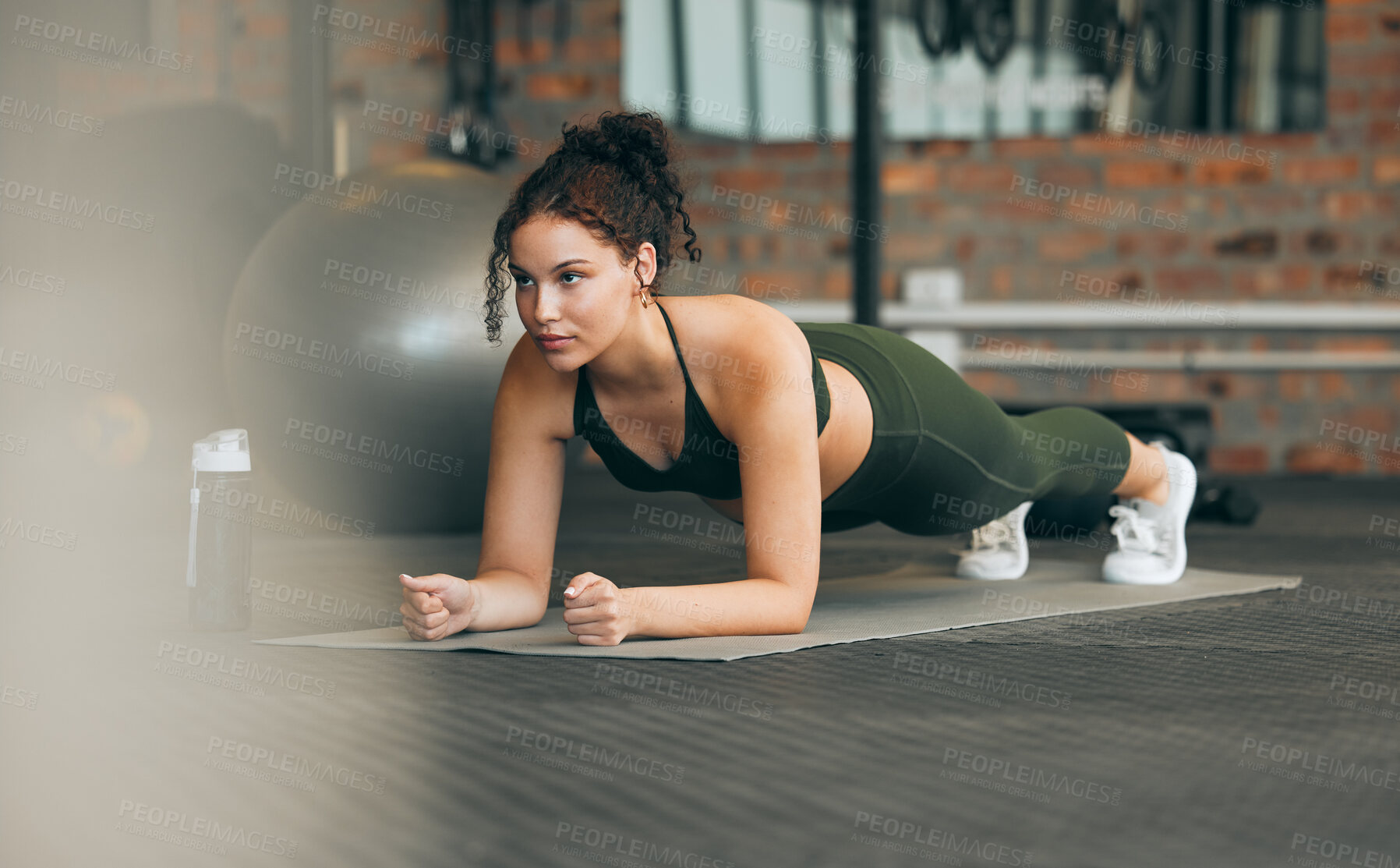 Buy stock photo Fitness, gym and workout of a woman doing plank exercise or training for wellness with focus for healthy lifestyle. Female athlete with body weight routine for strong core, sports health and balance
