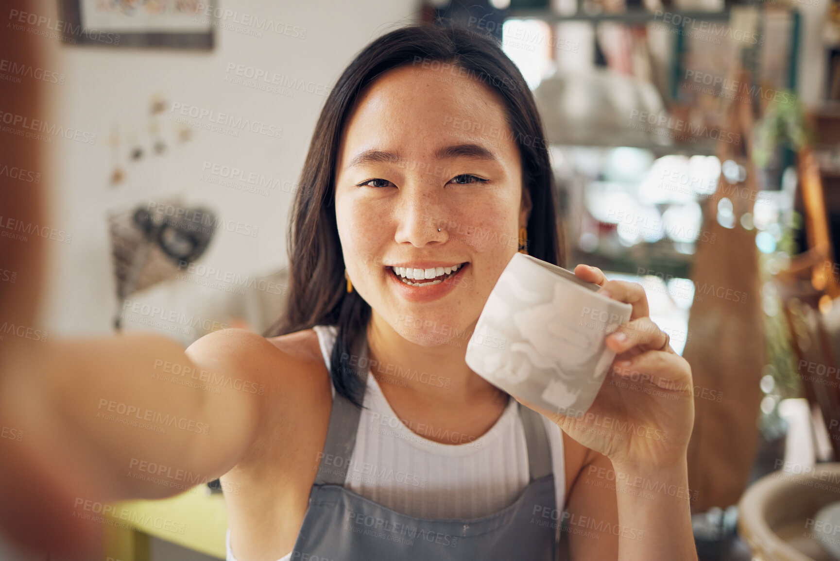 Buy stock photo Selfie, ceramic art and creative asian woman smile in pottery studio or worship for mug product design, culture creativity and artistic development. Artist woman, happy portrait and mud sculpture
