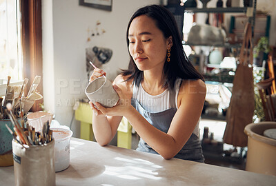 Buy stock photo Pottery, art and sculpture with a japanese woman in a studio for design or a creative hobby as an artisan. Manufacturing, pattern or artist with a female potter sitting in her workshop  as a sculptor