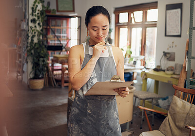 Buy stock photo Woman, thinking or clipboard in pottery studio, ceramic small business or Asian art workshop on class schedule. Mud, craft or designer worker with clay vision, ideas or innovation on paper documents