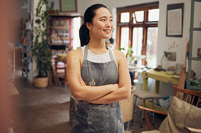 Buy stock photo Asian woman, potter and arms crossed in pottery studio, small business or ceramic workshop with ideas, vision or goals. Smile, happy and clay product worker with confidence and creative store design