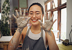 Pottery, happy and hands of a portrait woman at a messy workshop for art, design and work. Small business, dirty and creative artist with clay at a studio for creativity and artistic entrepreneurship