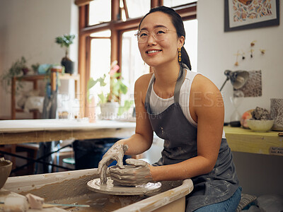 Buy stock photo Clay, pottery or creative woman in workshop working on an artistic cup or mug in small business. Smile, artistic girl or happy Japanese designer manufacturing handicraft products as entrepreneur 