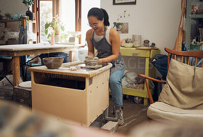 Clay, creative or woman in pottery workshop working on a cup sculpture or mug mold in small business. Focus, artistic girl or happy Japanese designer manufacturing handicraft products as entrepreneur