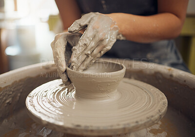 Hands, clay and pottery with a woman designer working in a studio or workshop for art, design and ceramics. Creative, sculpture and wheel with a female artist at work as a potter or ceramic artisan
