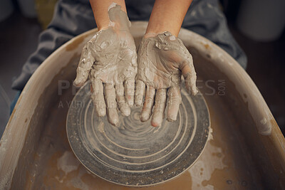 Buy stock photo Hands, clay and pottery wheel in a workshop after creating a sculpture or project for a small business. Creative, crafts and artistic sculptor manufacturing handicraft mould products in an art studio