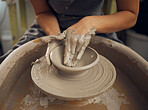 Clay, pottery or hands in designer workshop working on an artistic cup or mug mold in small business studio. Creative, artistic person or worker manufacturing handicraft products in sculpture process