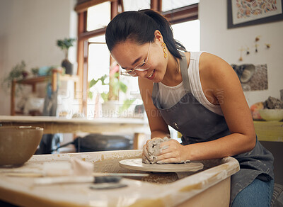 Buy stock photo Clay, happy or creative woman in workshop working on an artistic cup or mug mold in small business. Pottery project, Asian girl or Japanese designer manufacturing handicraft products as entrepreneur 