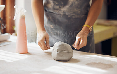 Buy stock photo Woman, hands and cut clay in pottery studio, workshop and creative startup for sculpture product. Ceramic artist, wire cutter and process for production, manufacturing and designer in small business