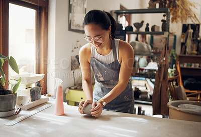 Buy stock photo Small business, art and pottery girl entrepreneur in workshop with clay for creativity and inspiration. Creative asian woman working at artistic workspace with happy smile in Tokyo, Japan

