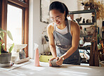 Happy, pottery and woman in workshop with clay for creativity, inspiration and art process. Creative asian small business girl working at artistic workspace with excited smile in Tokyo, Japan

