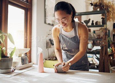 Buy stock photo Happy, pottery and woman in workshop with clay for creativity, inspiration and art process. Creative asian small business girl working at artistic workspace with excited smile in Tokyo, Japan

