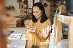 Phone, relax or Japanese woman on social media typing, texting or searching for online content on break. Chat, entrepreneur or happy Asian girl smiles when reading news on a social networking website