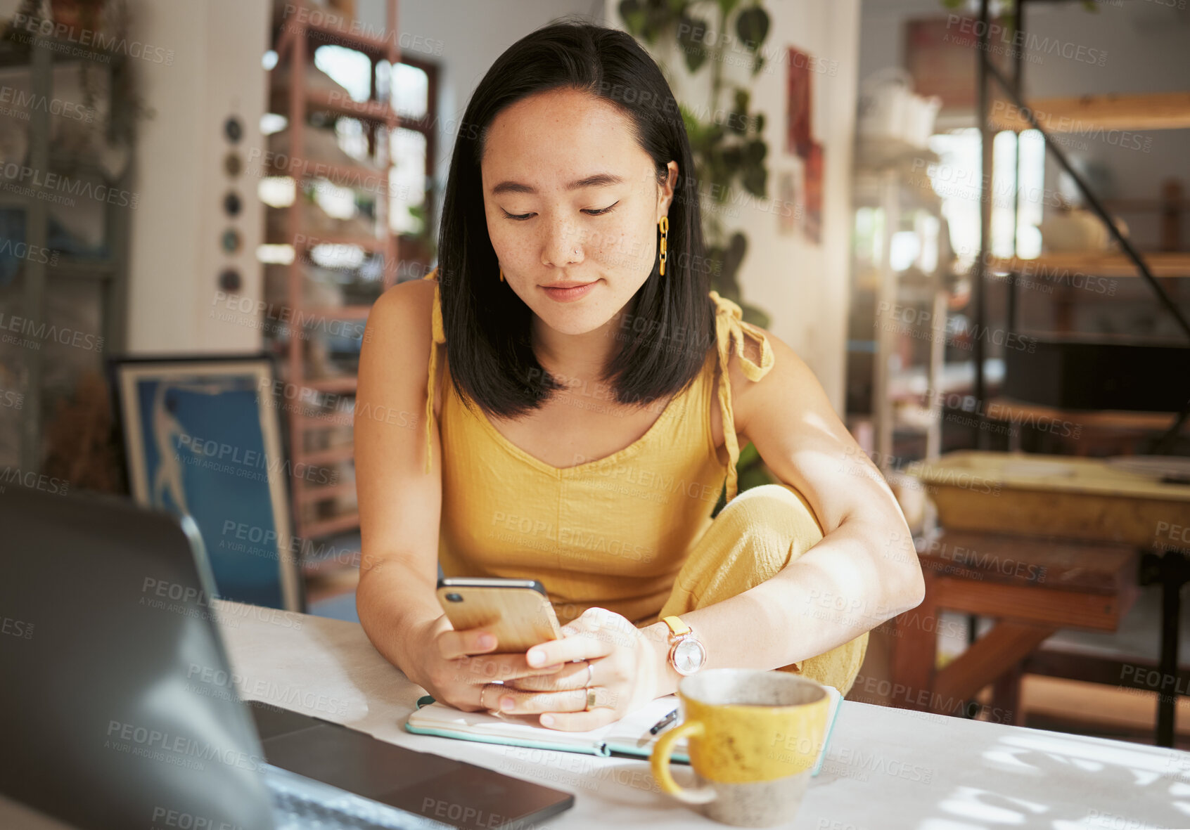 Buy stock photo Asian woman, cafe and smartphone for connection, remote work and lady with online research, chatting and comfortable. Female, creative and freelancer in coffee shop, relax and texting for project