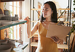 Pottery stock check, business woman and clipboard data of a entrepreneur with store information. Happy, counting and startup worker busy working on a ceramic inventory search for accounting audit