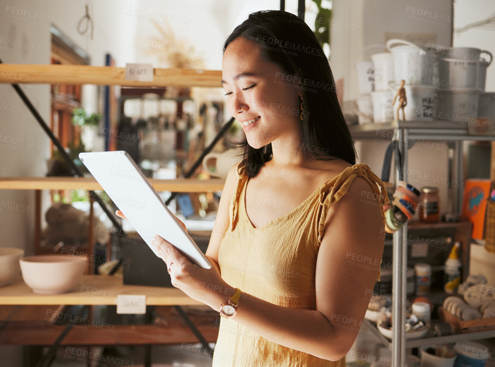 Buy stock photo Asian creative business woman, tablet and smile for social media, communication or networking at workshop. Happy Japanese female smiling holding touchscreen for pottery art, inventory or startup