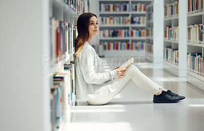 Buy stock photo Education, library and woman reading a book, college learning and thinking of research knowledge. Books, scholarship and student with an idea for university information while studying on campus