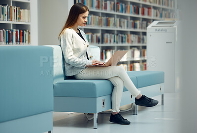 Buy stock photo Library, research and girl with laptop on sofa for education, studying and writing online report. Ideas, knowledge and girl in modern bookstore typing academic review, project and email on computer
