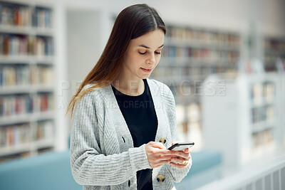 Buy stock photo Smartphone, bookstore and woman typing a text message, reading blog or doing research on internet. Books, library and young student networking on social media or mobile app on cellphone at university
