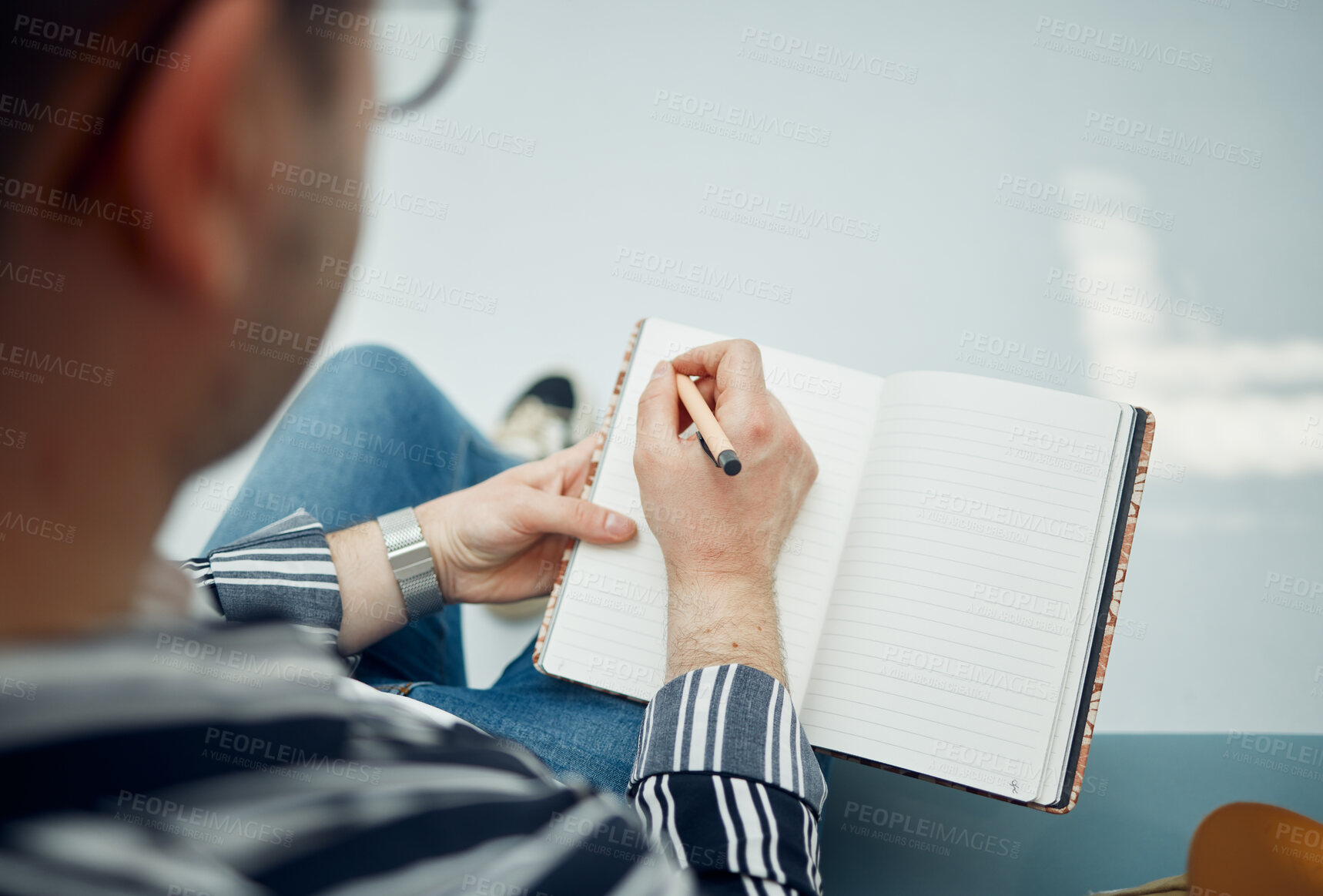 Buy stock photo Top view, man and writing in notebook, planning and focus on schedule, solutions and essay. Male student, academic and writer with diary, journal and pen for studying, creative and thinking with book