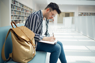 Buy stock photo Library, student and college man writing ideas for educational task in notebook with focus. Learning, knowledge and education of smart university guy thinking of assignment with concentration.

