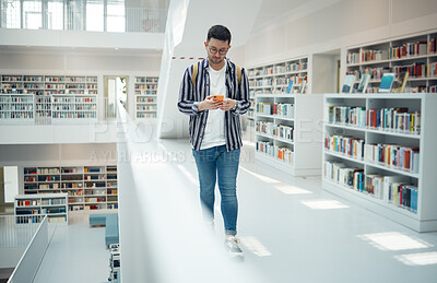 Buy stock photo Student walking in library with phone for university, education or college website, internet search and academy faq, about us or contact. Campus, cellphone and teenager reading scholarship newsletter