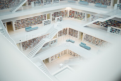 Buy stock photo Library, research and education with books in an empty room with stairs to a floor on university or college campus. Learning, study and scholarship with book shelves in a school for development