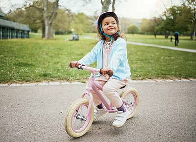 Buy stock photo Cycling, thinking and child on a bike in the park, outdoor activity and learning in New Zealand. Sport, happiness and girl kid playing on bicycle ride in the neighborhood street or road in childhood