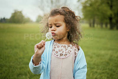 Buy stock photo Nature, relax and child with blowing a dandelion for a wish, playing and exploring on a field in Norway. Spring, playful and girl with a flower plant in a park for calm, peace and outdoor adventure