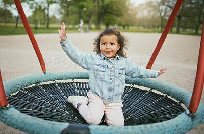 Buy stock photo Play in playground, girl child in park with outdoor fun, early childhood development with toddler on trampoline. Kid, freedom and energy, playful and playing during holiday and growth in nature