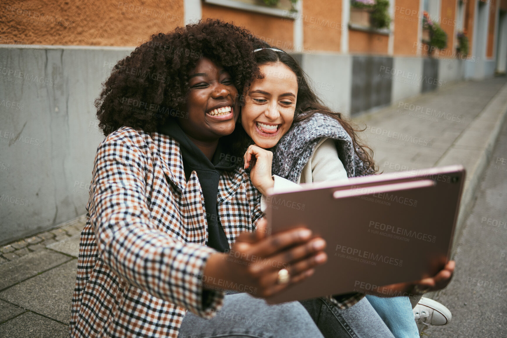 Buy stock photo City, friends and women take selfie on tablet while sitting on sidewalk laughing and happy together. Photo, video call and black woman with girl friend with urban fun and social media profile picture