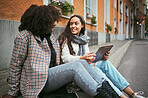 Street, friends and women talking, tablet and social media for connection, conversation and bonding outdoor. Young females, ladies and device for online reading, city and girls on road and discussion