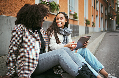 Buy stock photo Street, friends and women talking, tablet and social media for connection, conversation and bonding outdoor. Young females, ladies and device for online reading, city and girls on road and discussion