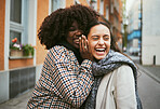 Friends, gossip in ear and women in street laughing at secret joke in city with smile on face. Urban secrets, rumor and whisper in ears, black woman with friend laugh at funny story on walk in town.