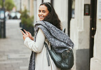 Walking, phone and portrait of woman travel on urban city street, road or on holiday adventure journey In London UK. Mobile smartphone, sidewalk and girl typing on winter vacation journey in England