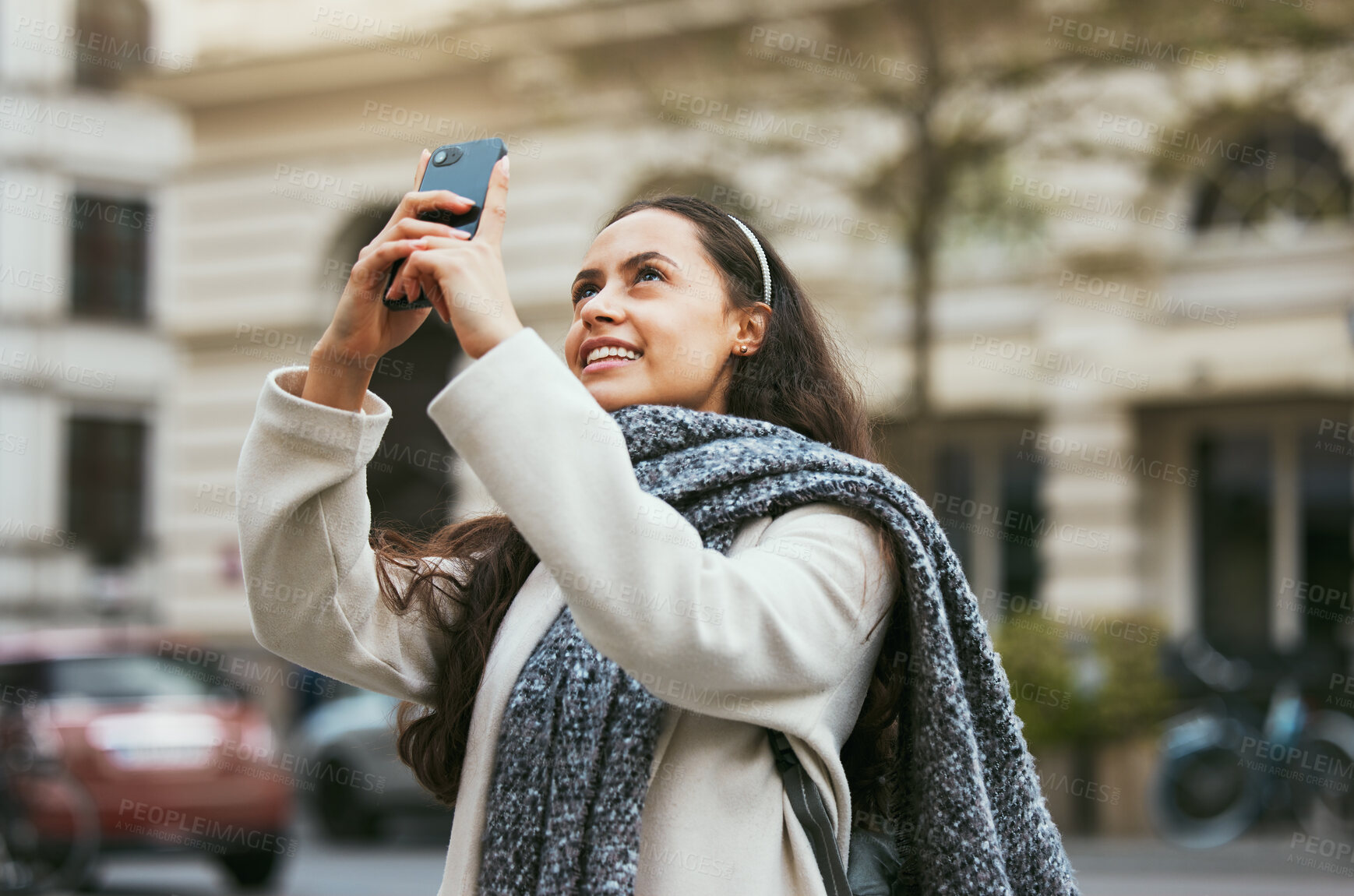 Buy stock photo Travel, tourist and photograph with a woman in the city taking a picture while traveling abroad on holiday or vacation. Phone, tourism and mobile with a female traveler while sightseeing overseas